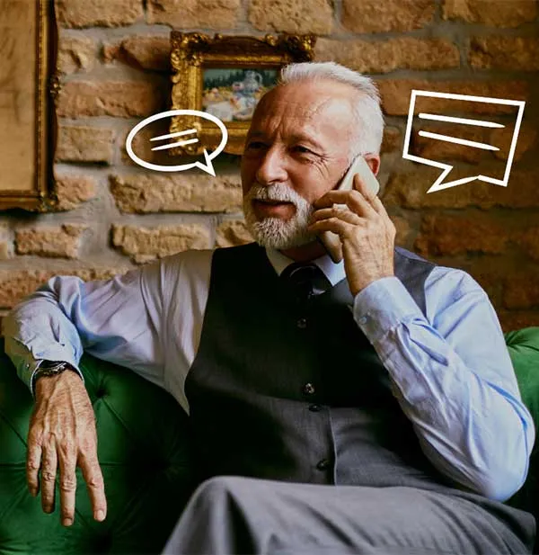 Man sitting on green sofa.