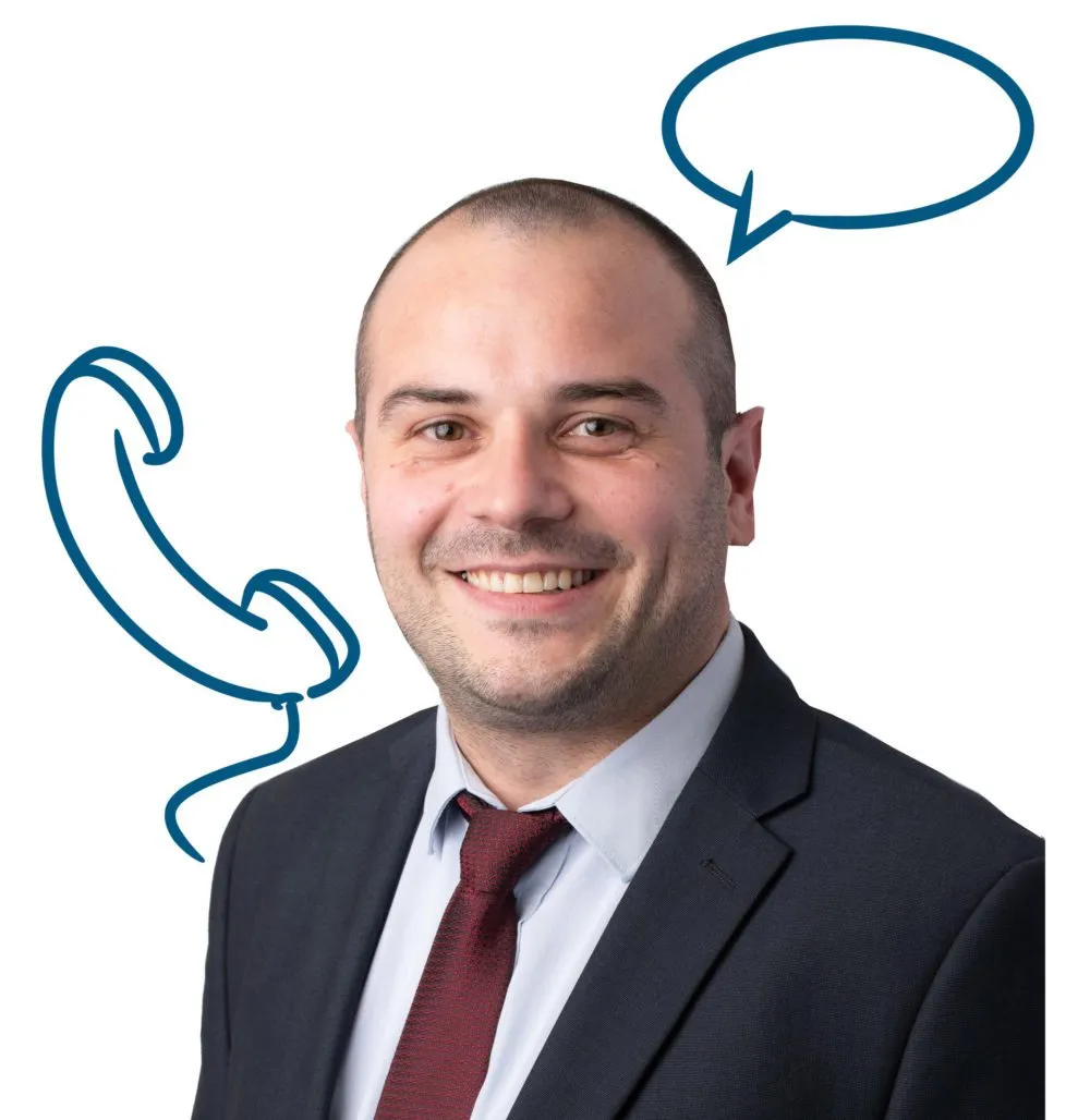 A man in a suit and tie smiling, with a cartoon phone and speech bubble drawn on the background next to his head.